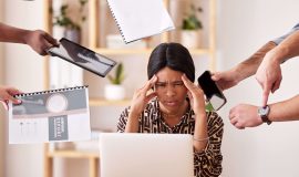 woman-business-manager-suffering-burnout-anxiety-stress-work-corporate-office-by-team-black-professional-marketing-leader-with-headache-tired-worried-with-work-while-depressed